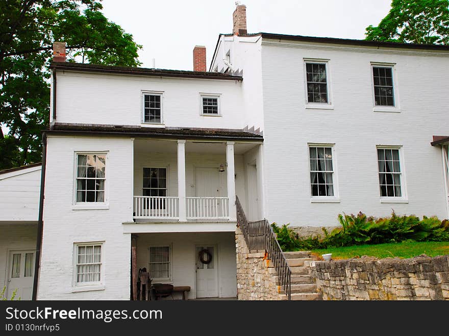 This is a shot of an old black and white painted farmhouse. This is a shot of an old black and white painted farmhouse.