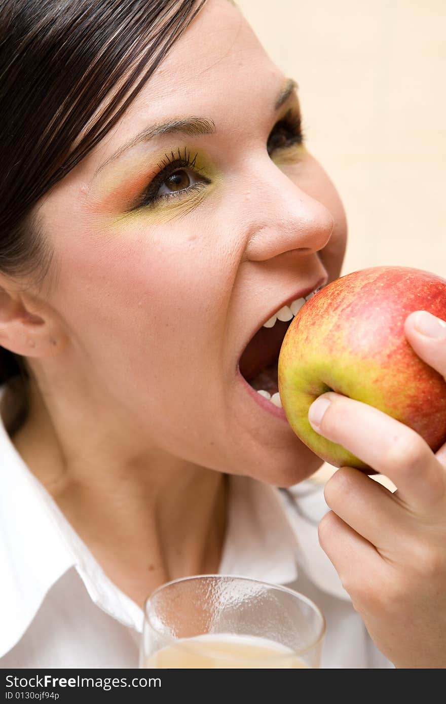 Attractive brunette woman with apple. Attractive brunette woman with apple