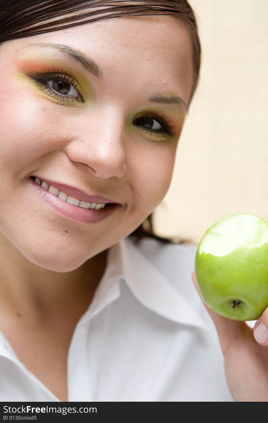 Attractive brunette woman with apple. Attractive brunette woman with apple