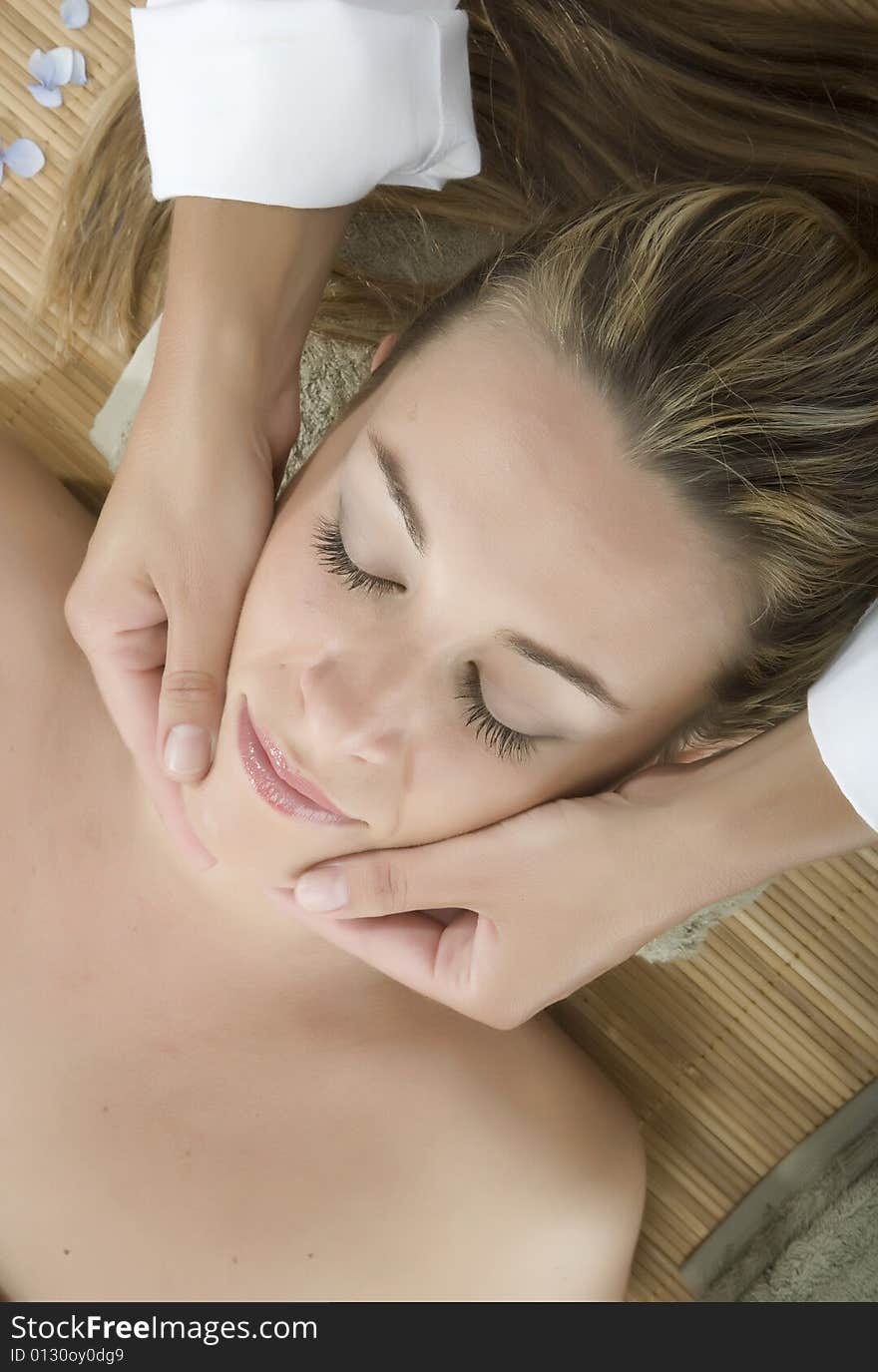 Woman in a day spa getting a deep tissue massage therapy