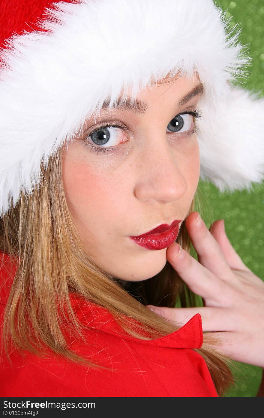 Teenager with red lips wearing a christmas hat. Teenager with red lips wearing a christmas hat