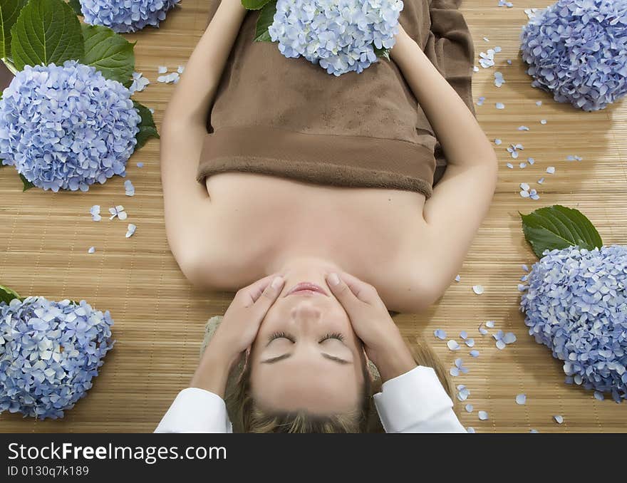 Woman in a day spa getting a deep tissue massage therapy