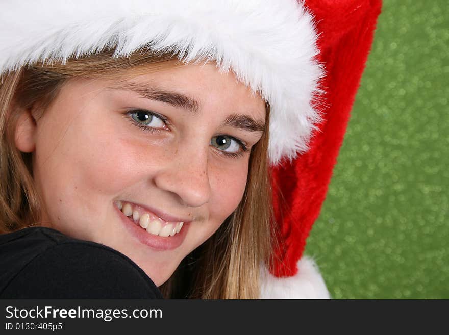 Teenager with red lips wearing a christmas hat. Teenager with red lips wearing a christmas hat