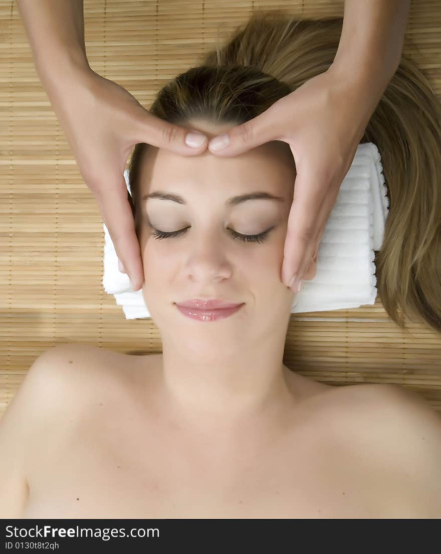 Woman in a day spa getting a deep tissue massage therapy