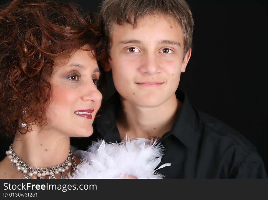 Rich and stylish mother and son in formal attire