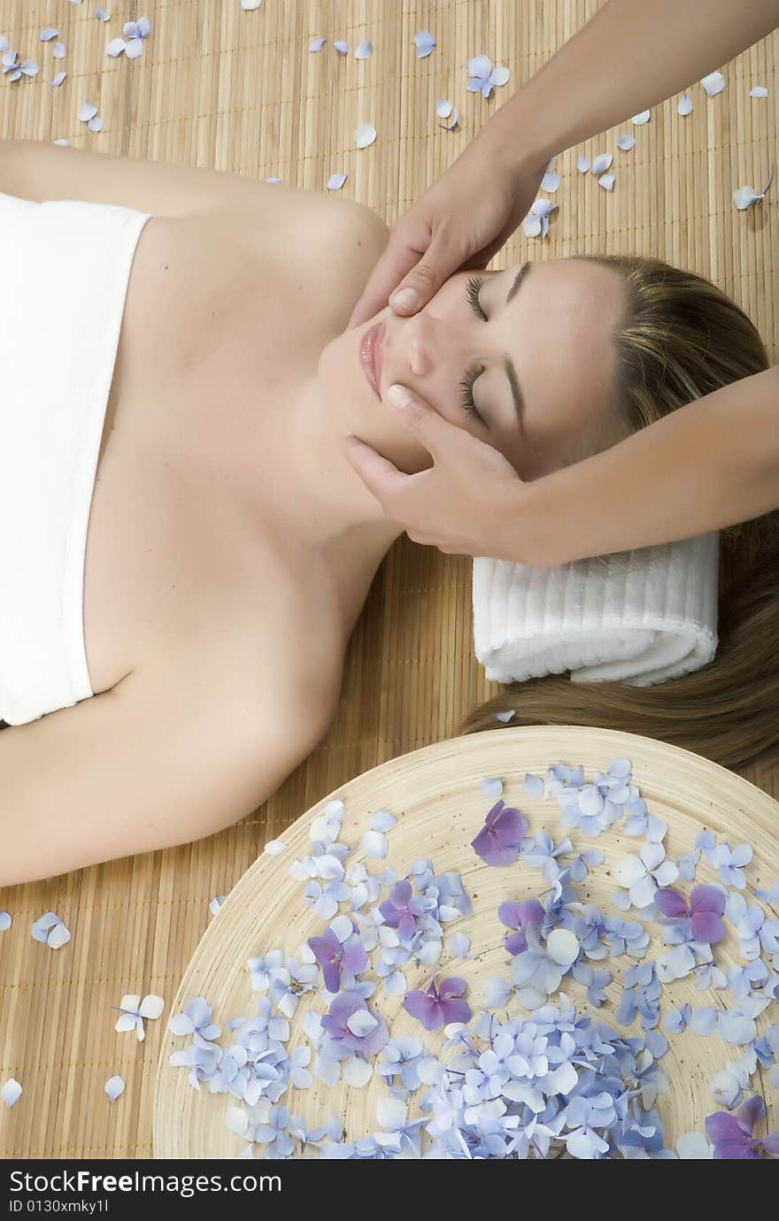 Woman in a day spa getting a deep tissue massage therapy