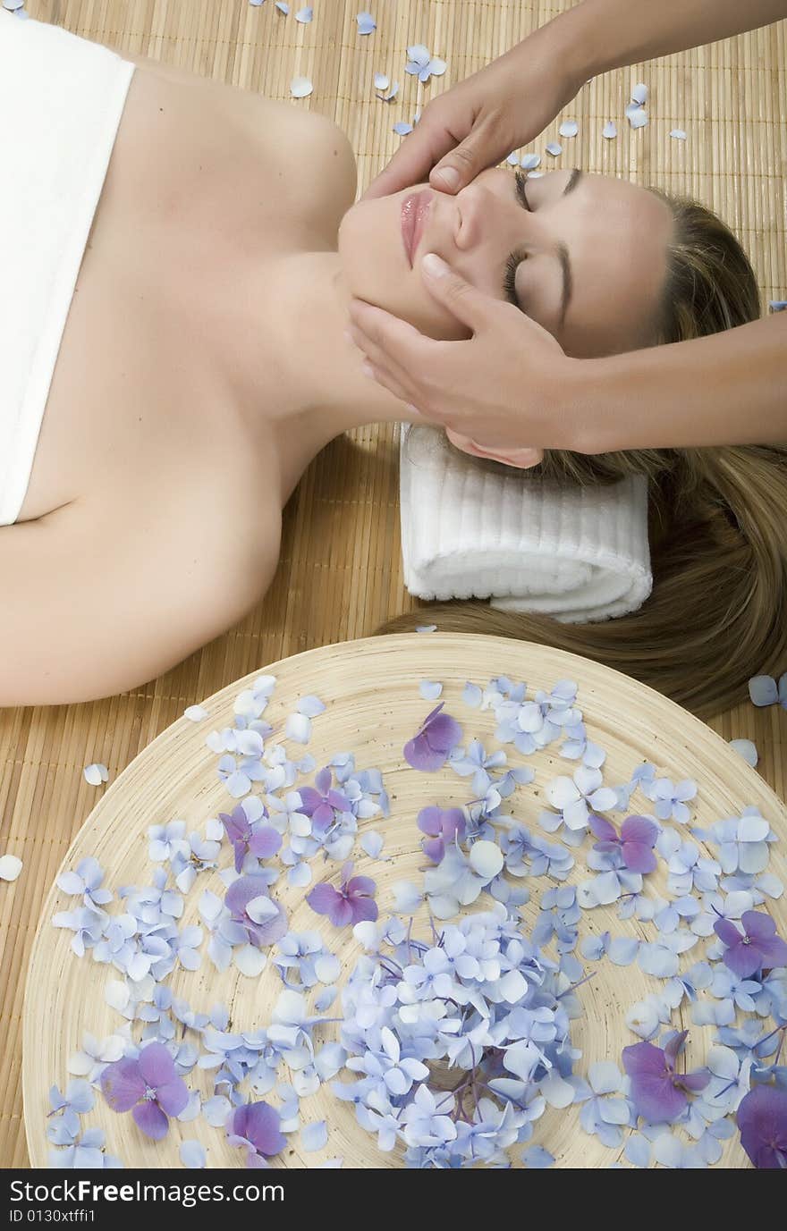 Woman in a day spa getting a deep tissue massage therapy