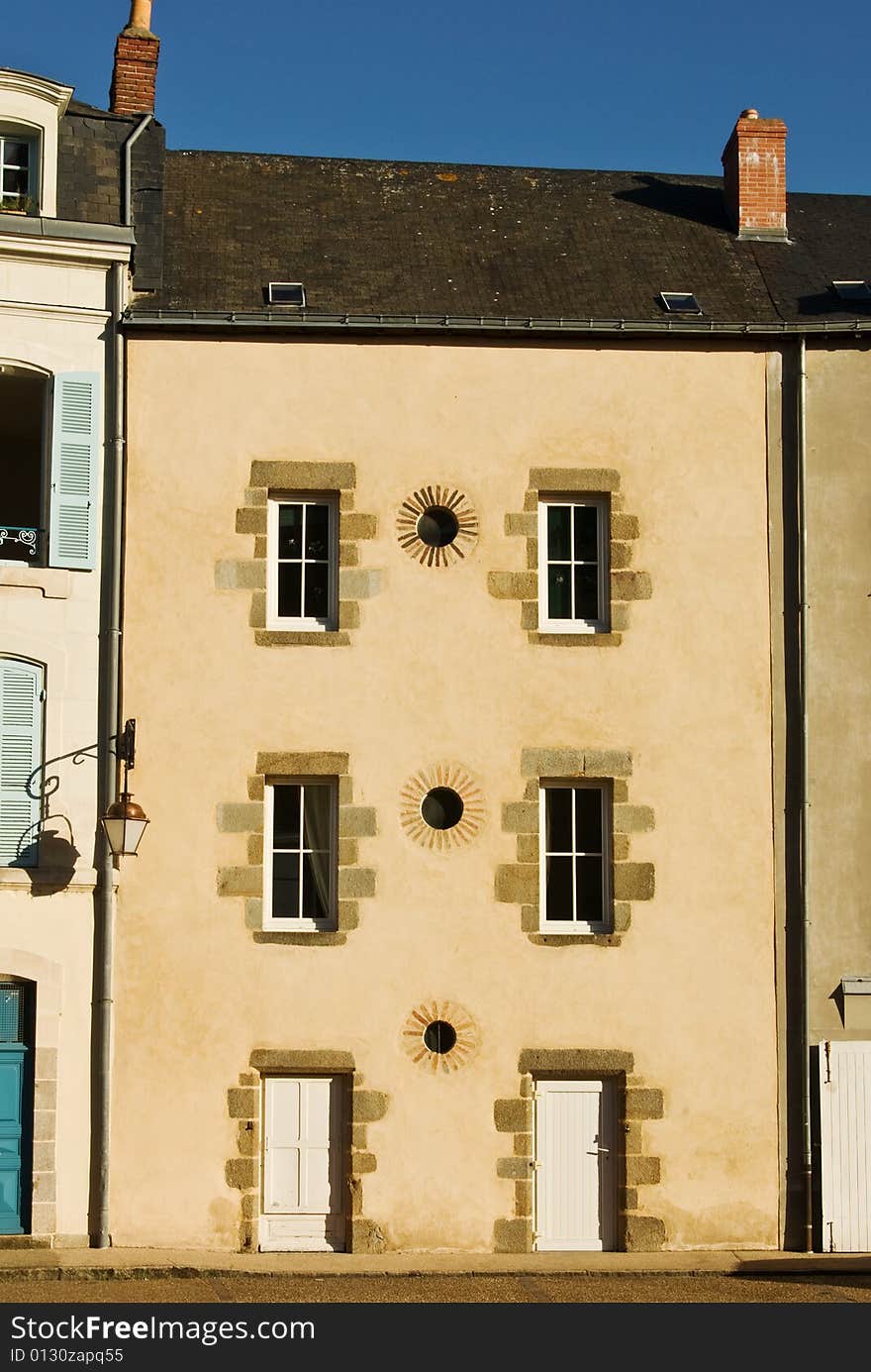 A classic French town house basks in the evening sun