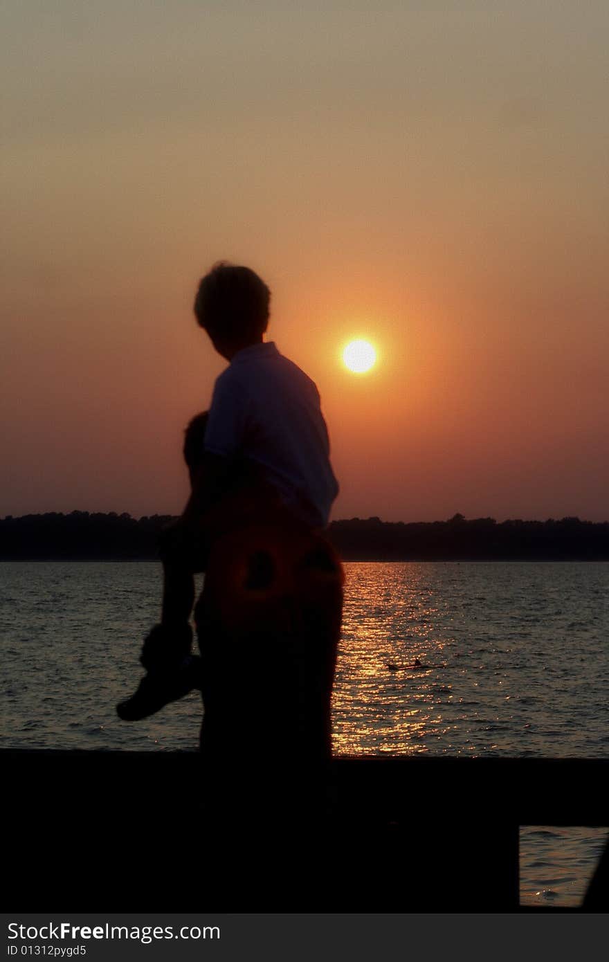 Photo of a father and sun with a nice sunset surrounding sky. Photo of a father and sun with a nice sunset surrounding sky.