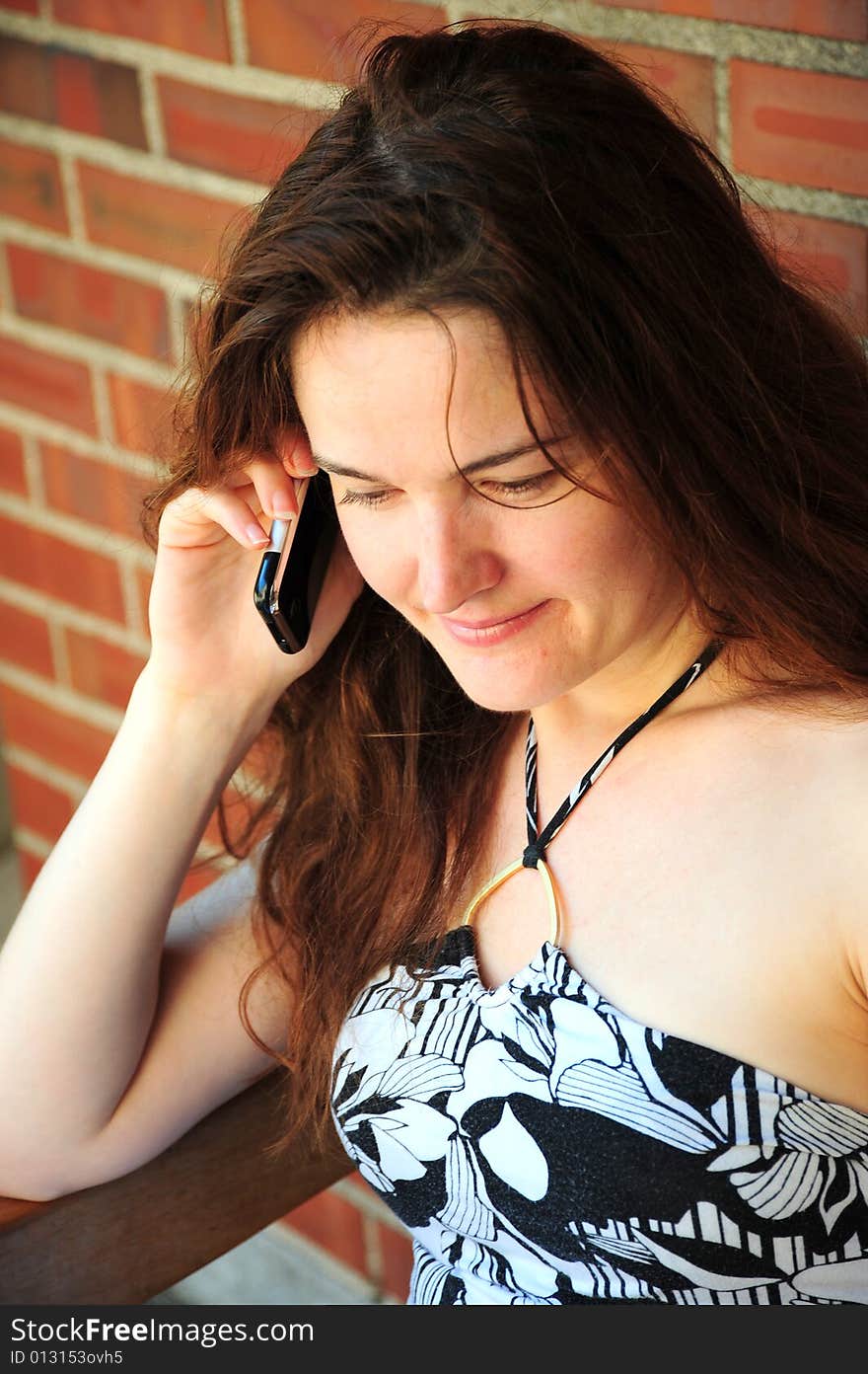 Female beauty talking on a cellphone.