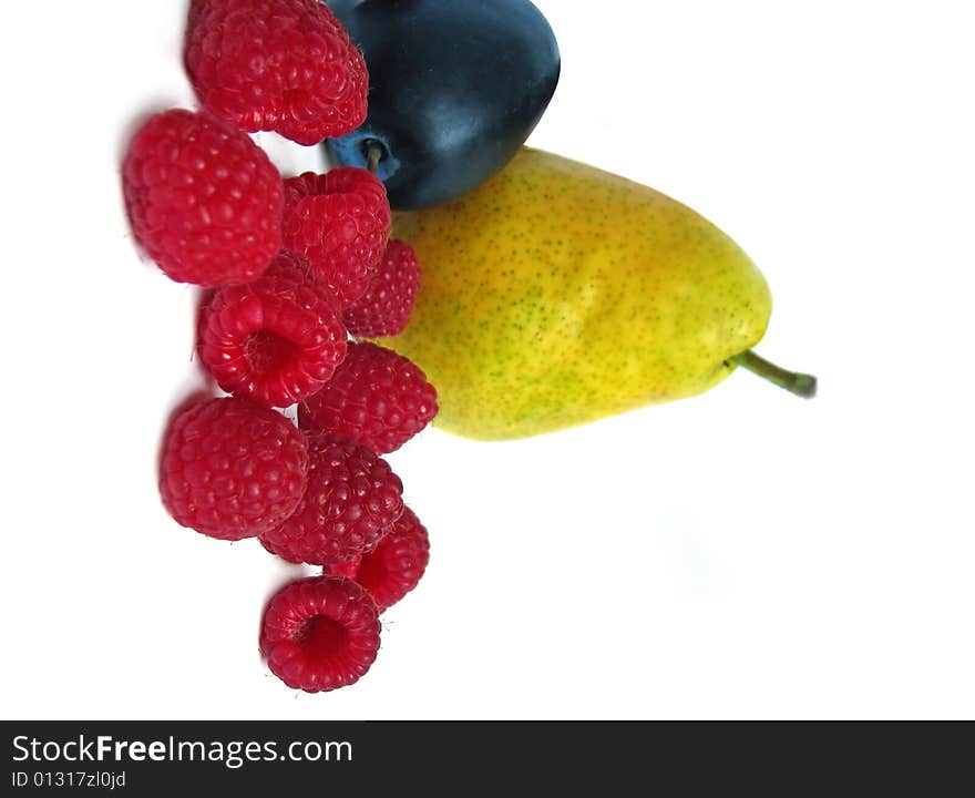 Raspberry, plum and pear isolated on white background