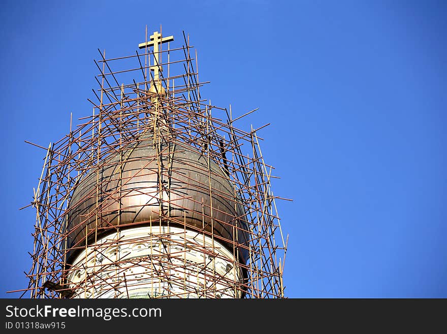 Scaffoldings around church cupola