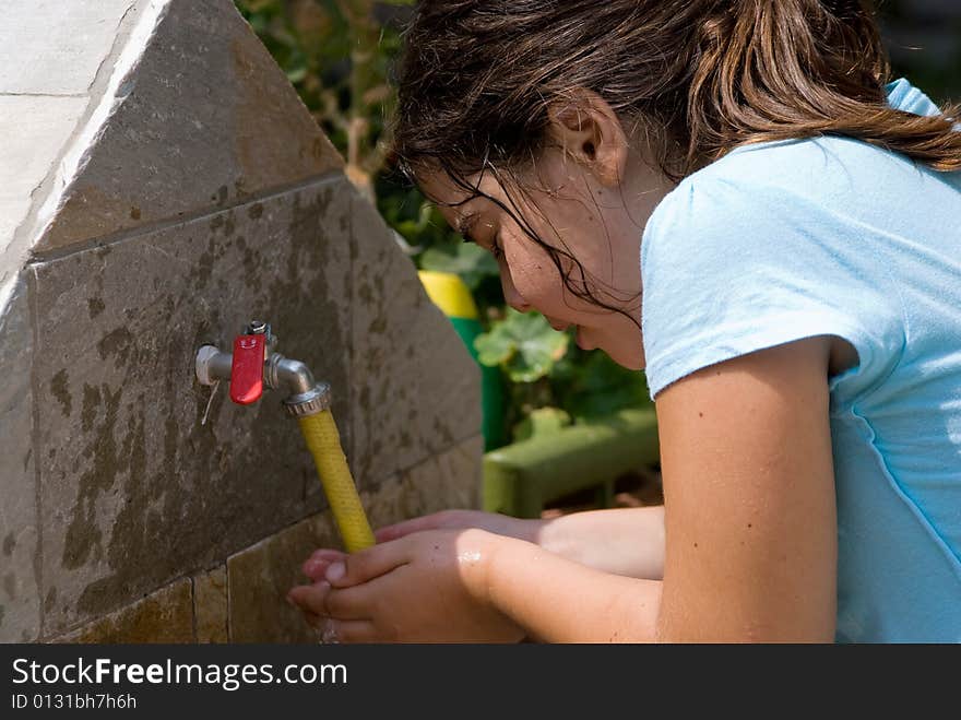 Girl washing her face