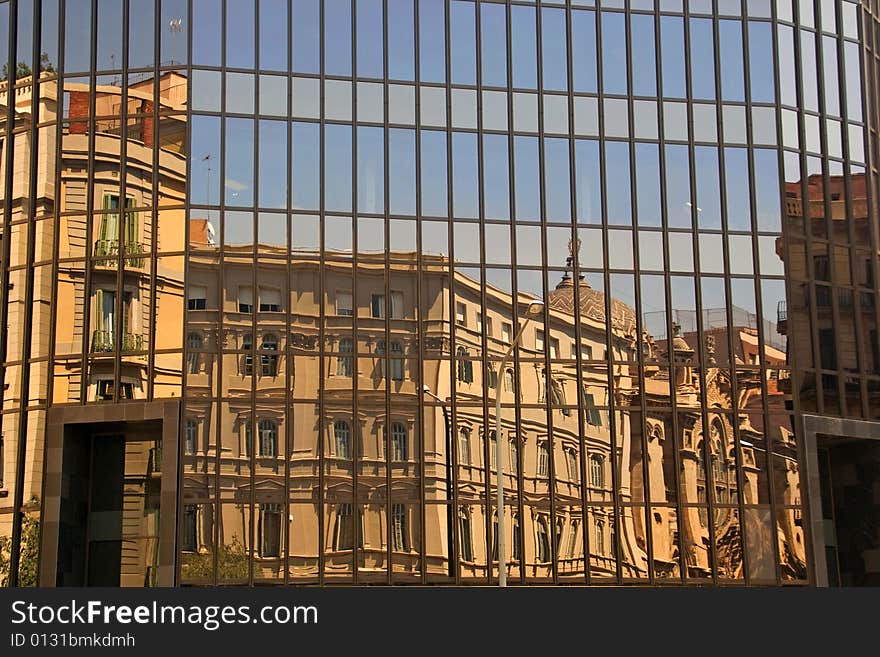 Buildings are reflected from one building. Buildings are reflected from one building