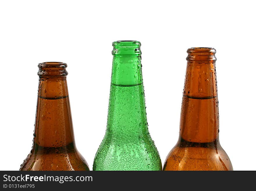 Three bottles of fresh cold water close up isolated