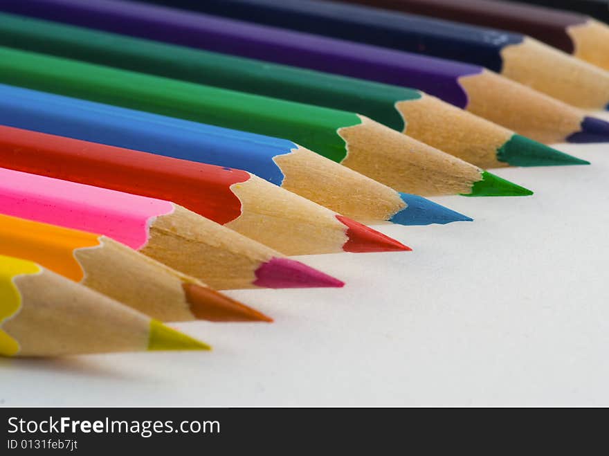 Closeup of colored crayons on white background