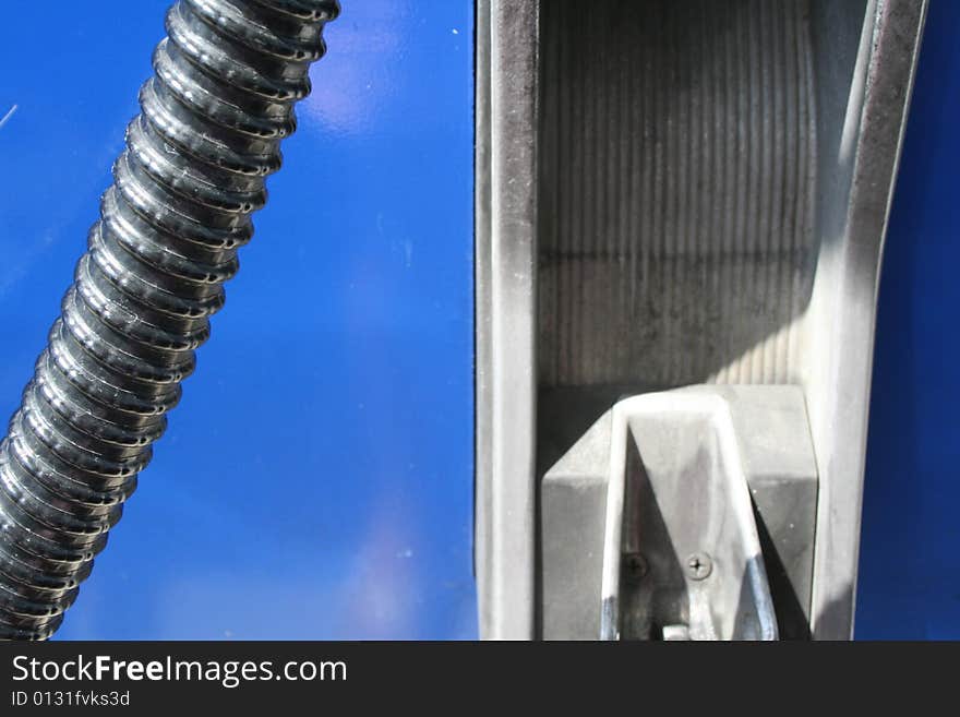 Close up of a gasoline pump showing the hose. Close up of a gasoline pump showing the hose.