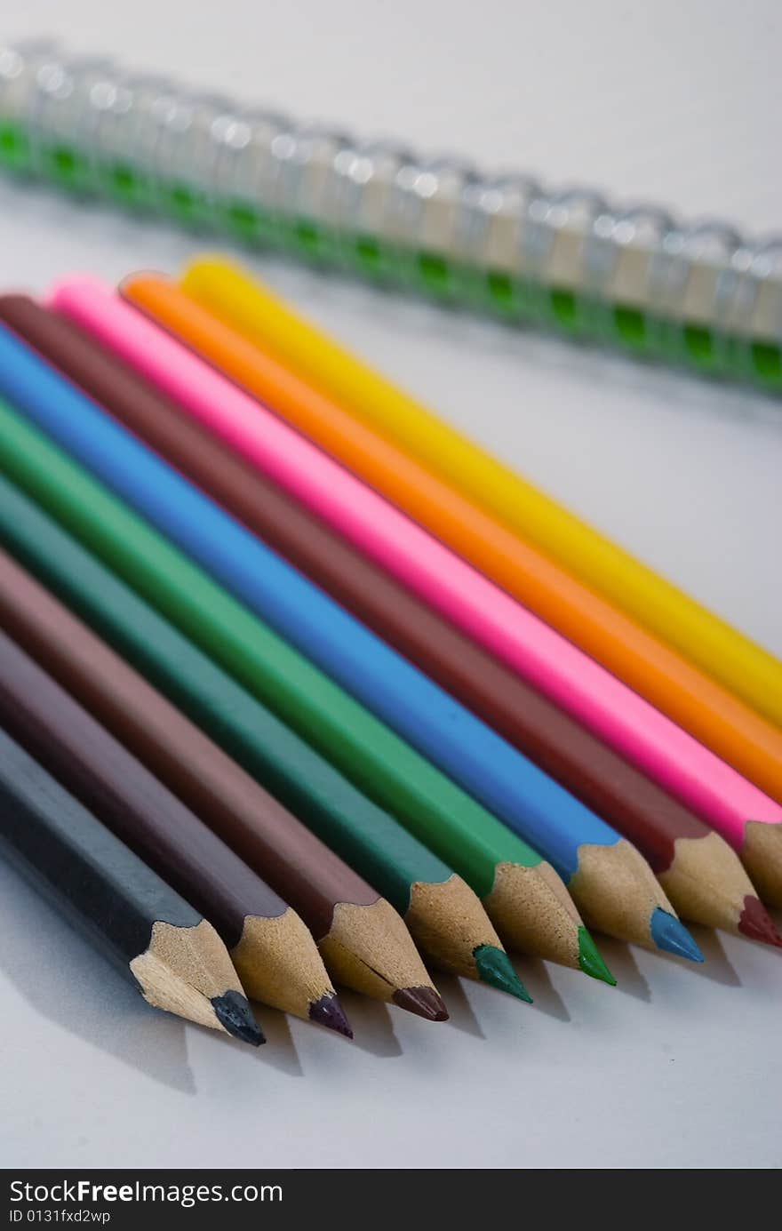 Closeup of colored crayons on white background