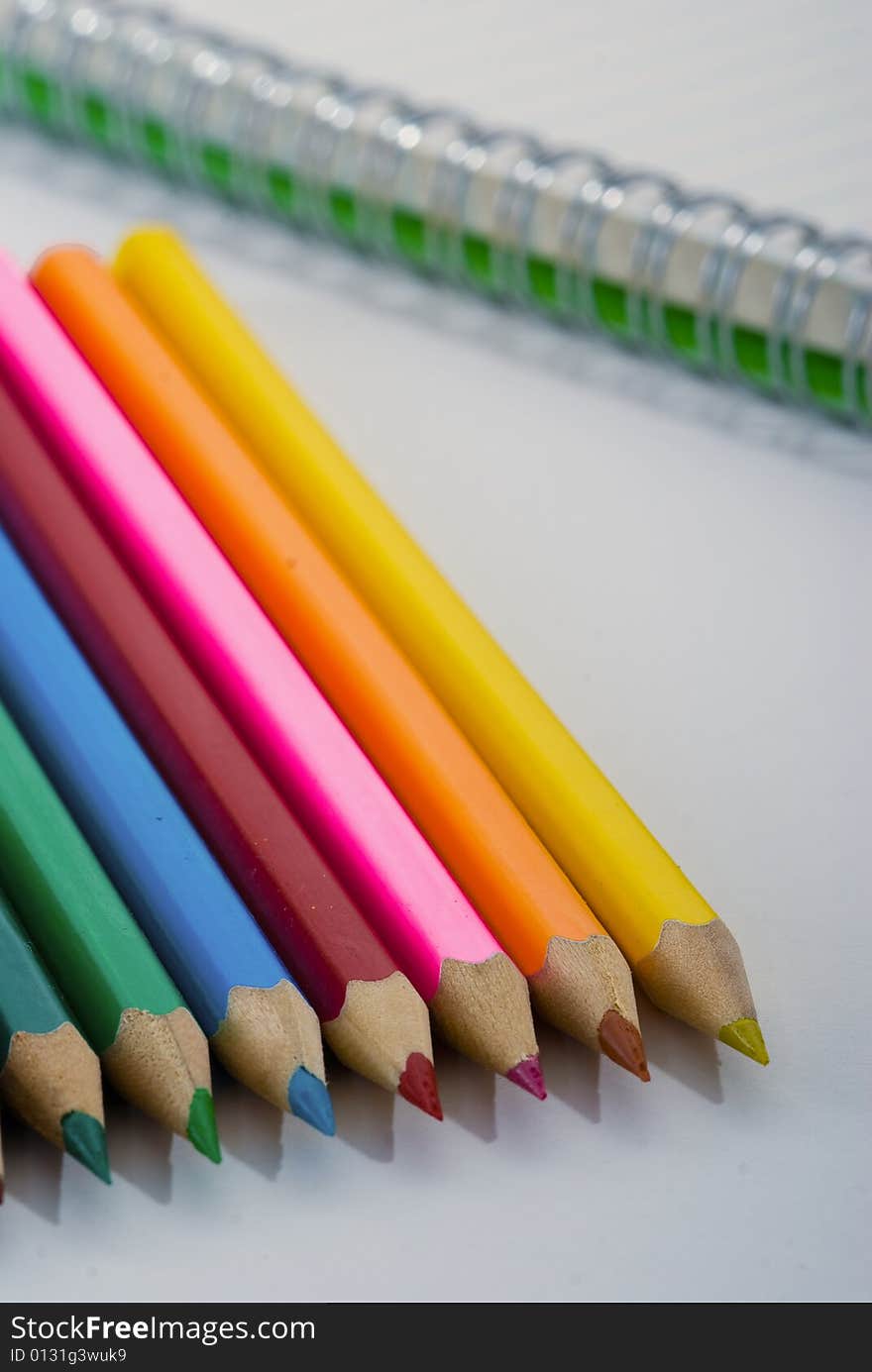 Closeup of colored crayons on white background