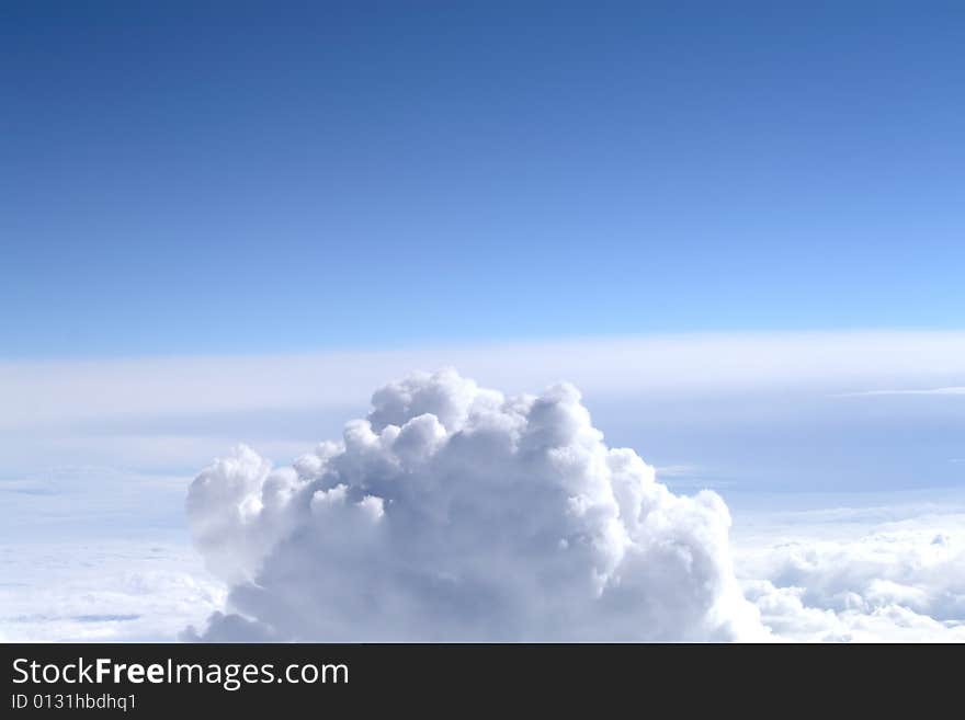 Background of blue sky with white cumulus clouds