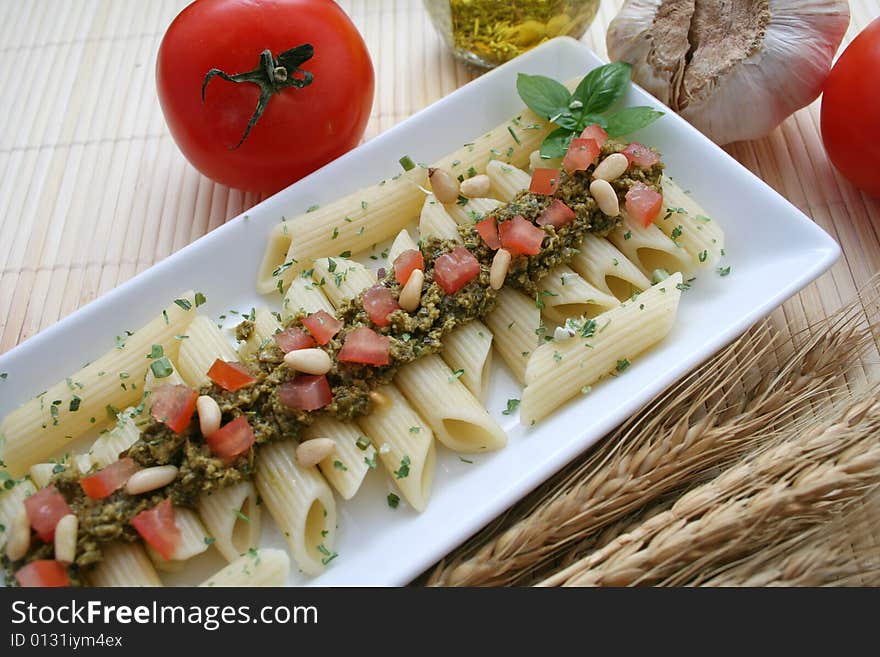 A Meal of noodles, Pesto and some tomatoes. A Meal of noodles, Pesto and some tomatoes