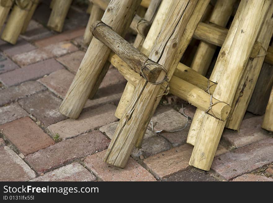 Mexican ladders stored on a brick patio. Mexican ladders stored on a brick patio.