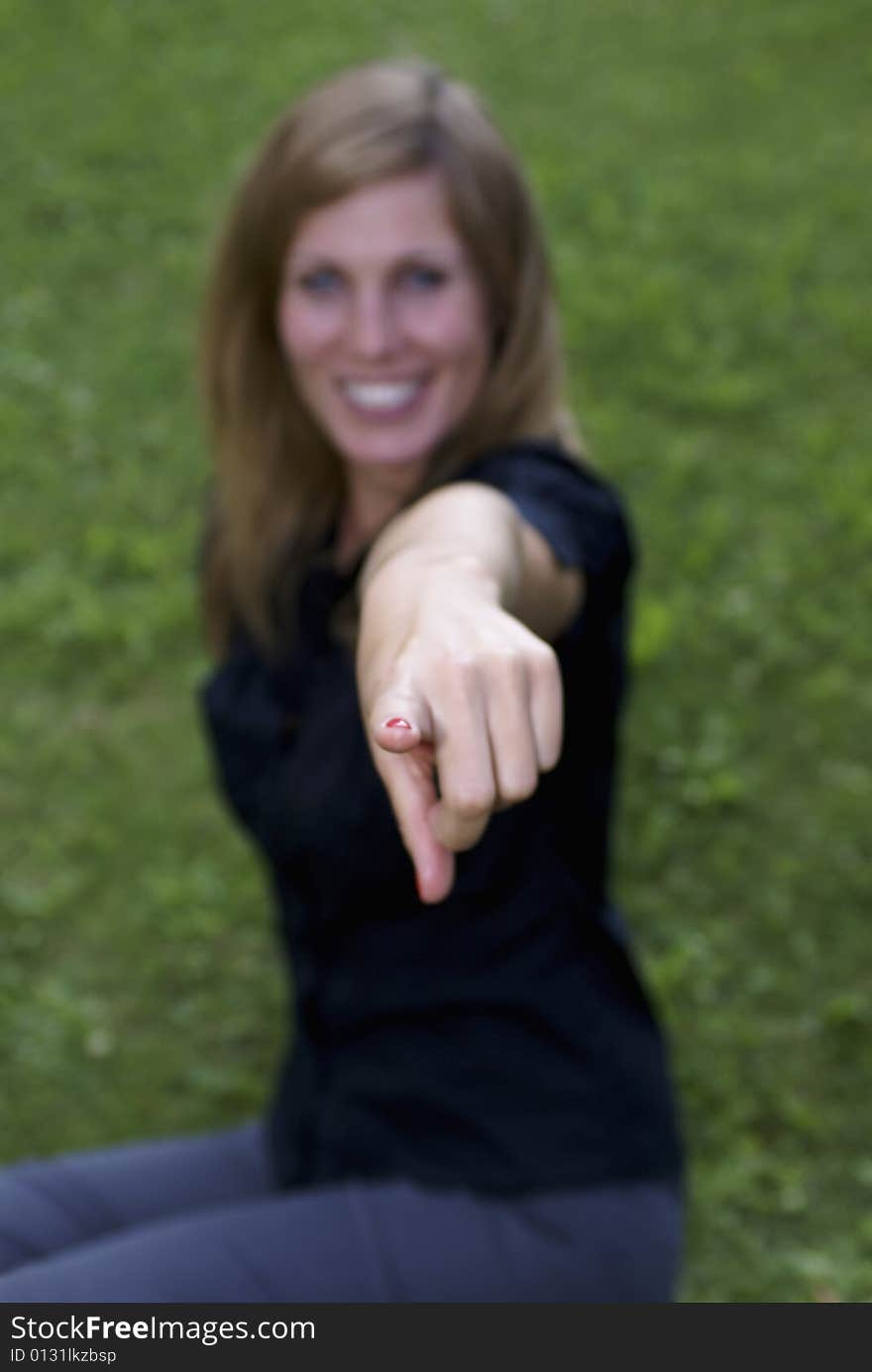 Woman pointing at the camera