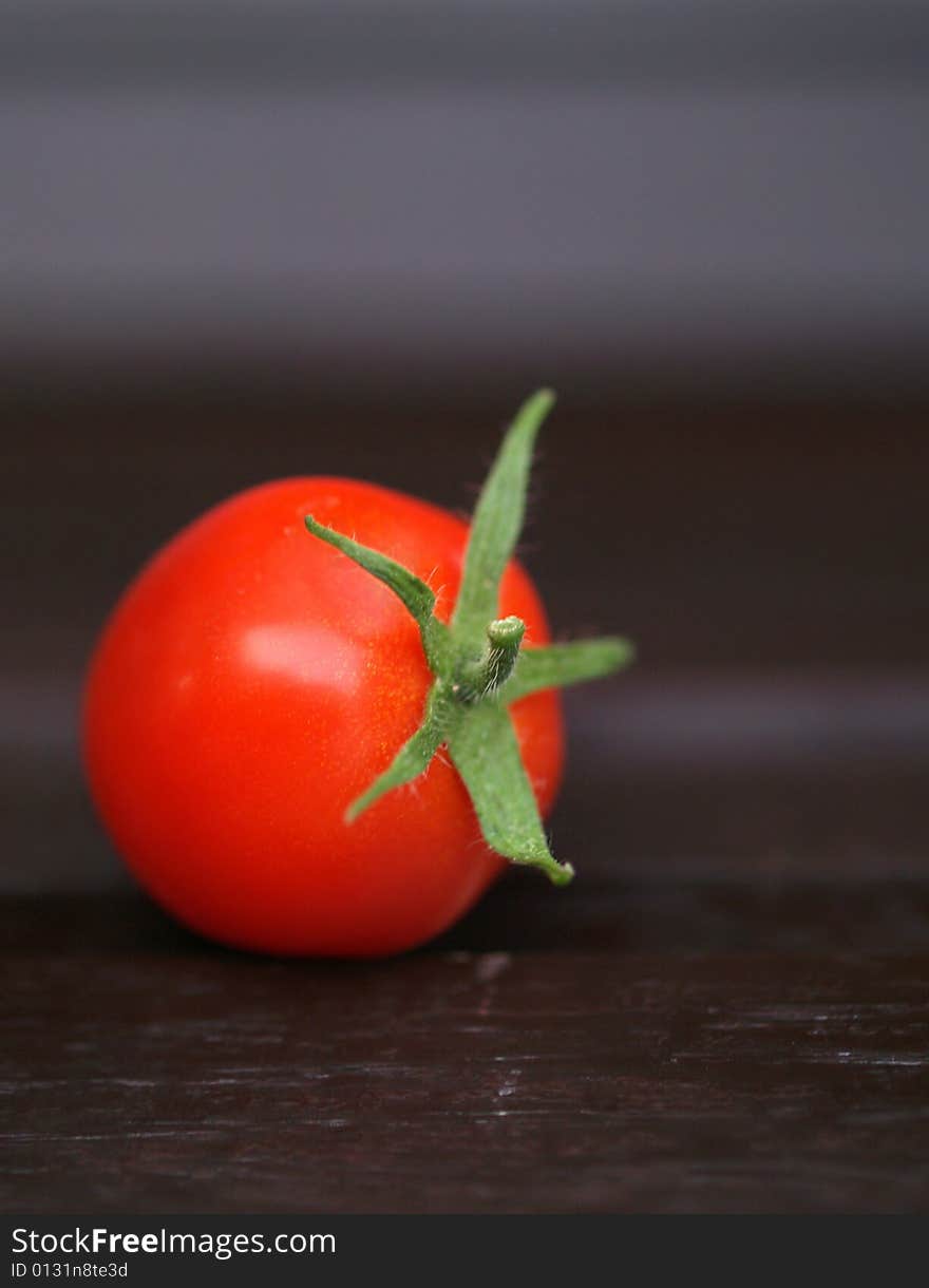 Red tomato in detail with blur background