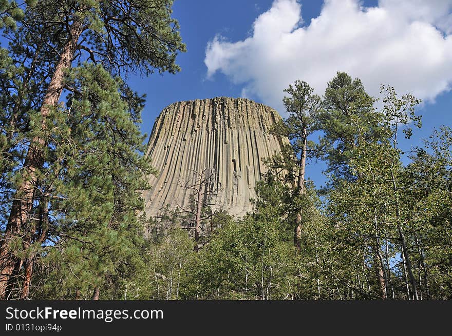 View of Devils Tower, Wyoming from the Northwest via the walking trail that circumnavigates the mountain. View of Devils Tower, Wyoming from the Northwest via the walking trail that circumnavigates the mountain.