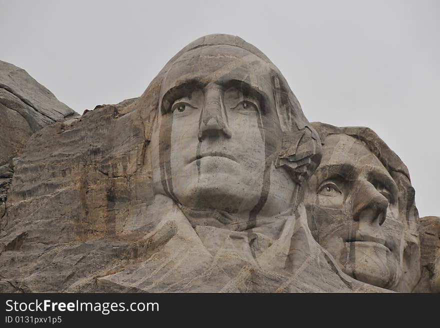 Washington and Jefferson dripping with rain during a late summer rain at Mount Rushmore. Washington and Jefferson dripping with rain during a late summer rain at Mount Rushmore