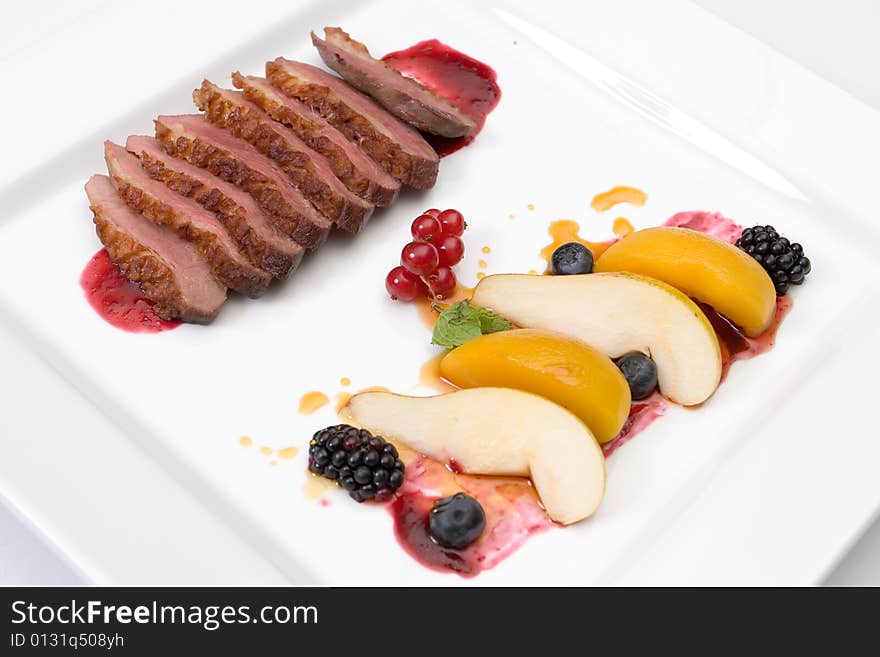 Refined food from a restaurant on a white plate. Refined food from a restaurant on a white plate