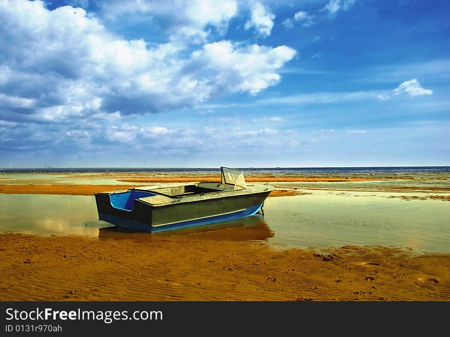 A lonely Boat in a low water