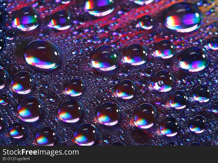 Abstract colorfull water drops on cd surface, shallow DOF