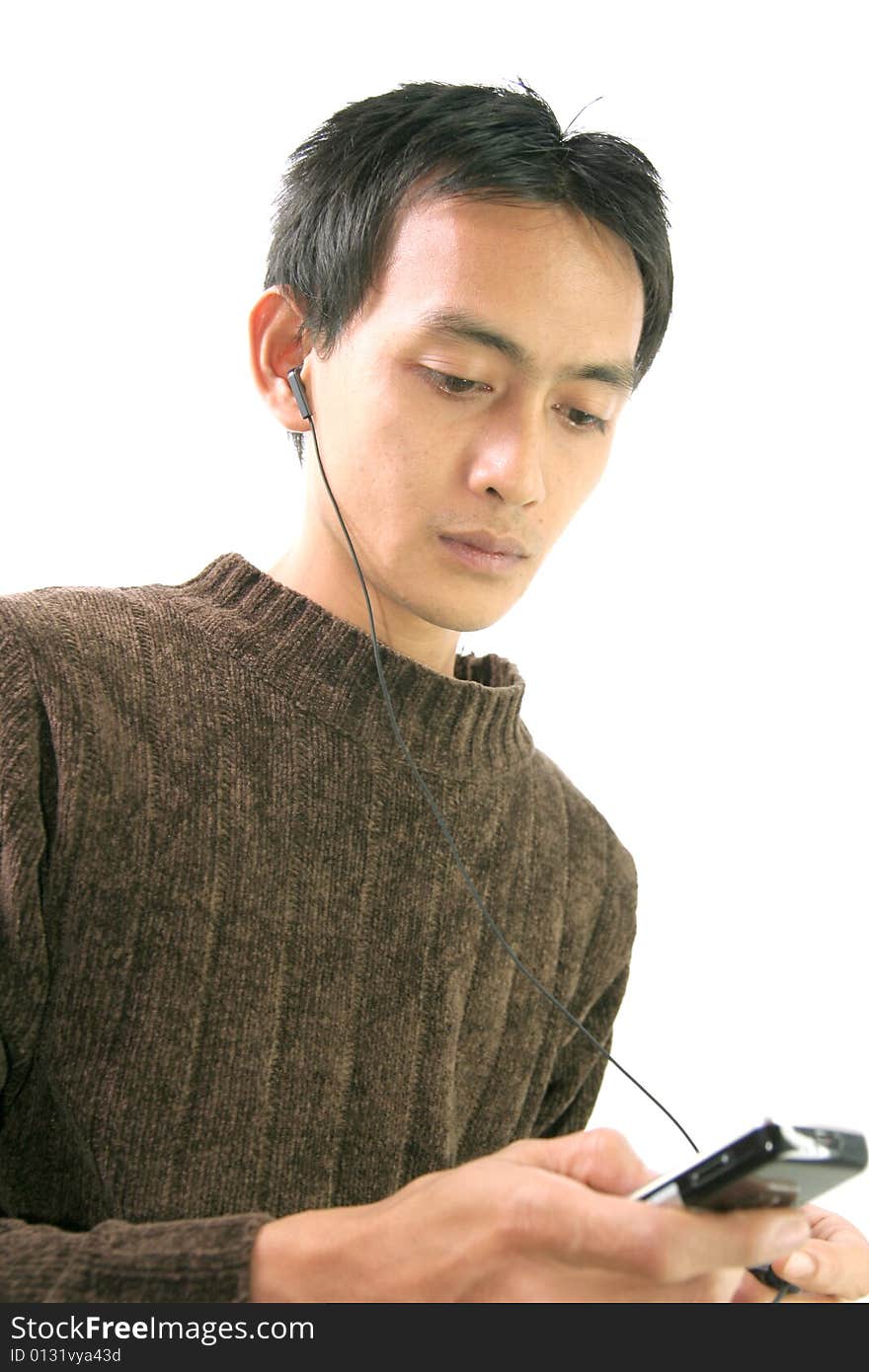 Man and cellular phone with headphone