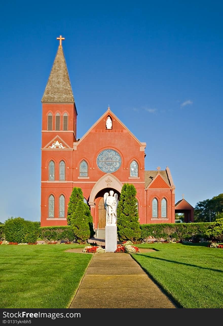 Red brick church and landscaped grounds. Red brick church and landscaped grounds