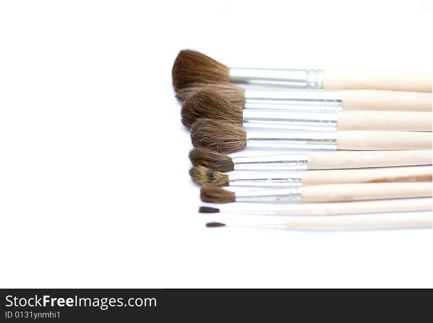 Different thickness proffesional brushes on white background