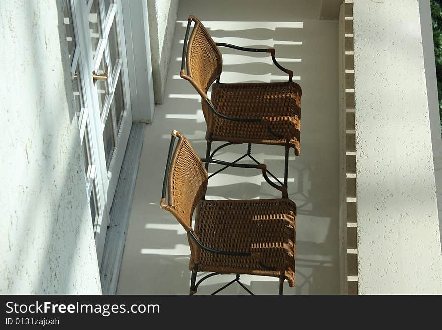 Two chairs awaiting bodies to pass the time with. Two chairs awaiting bodies to pass the time with.