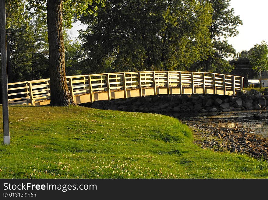 Bridge accessing an island on a lake. Bridge accessing an island on a lake