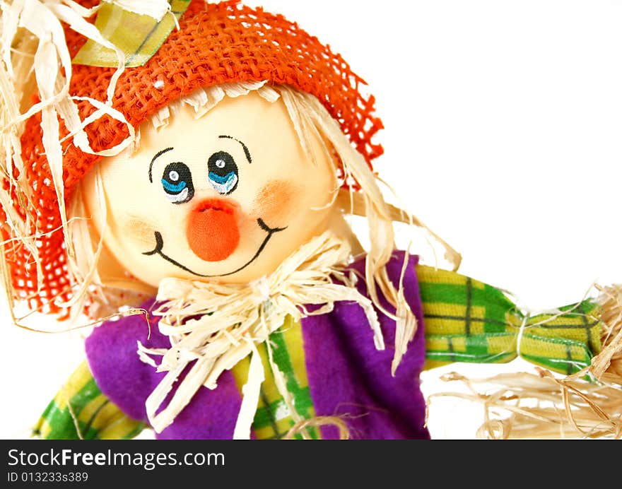 Close up of a scarecrow isolated on a white background. Used a shallow depth of field and selective focus on the face. Close up of a scarecrow isolated on a white background. Used a shallow depth of field and selective focus on the face.