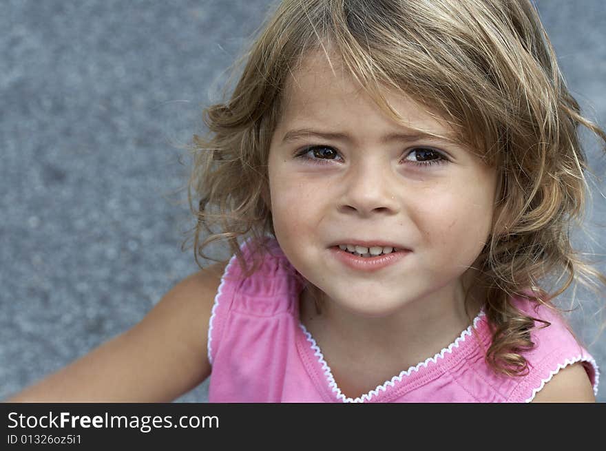 A picture of a cute little girl smiling. A picture of a cute little girl smiling