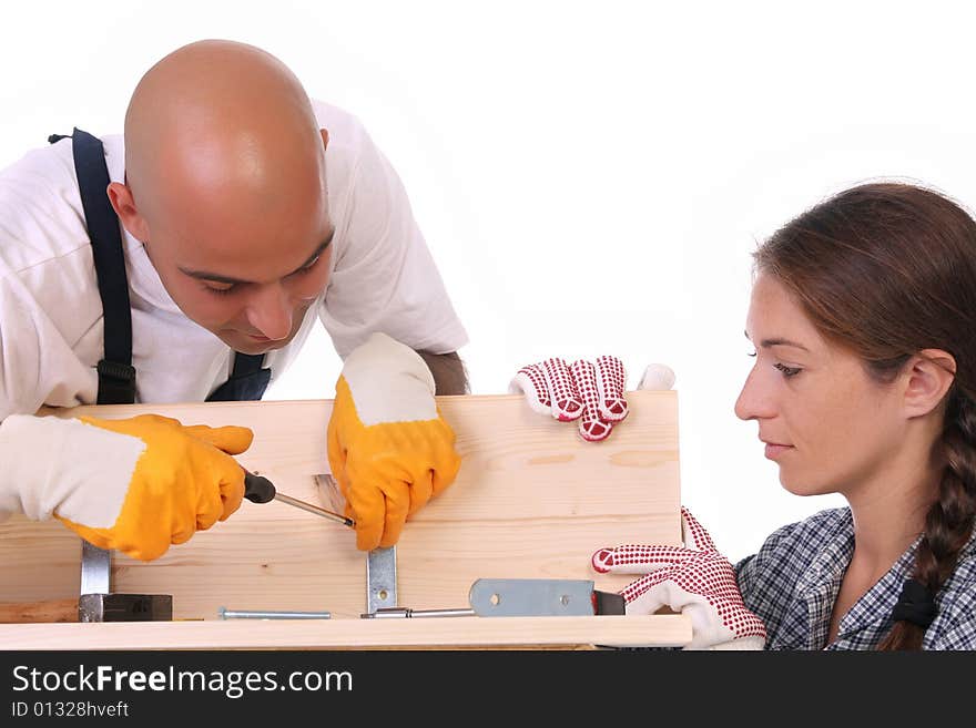 Construction workers at work on white background