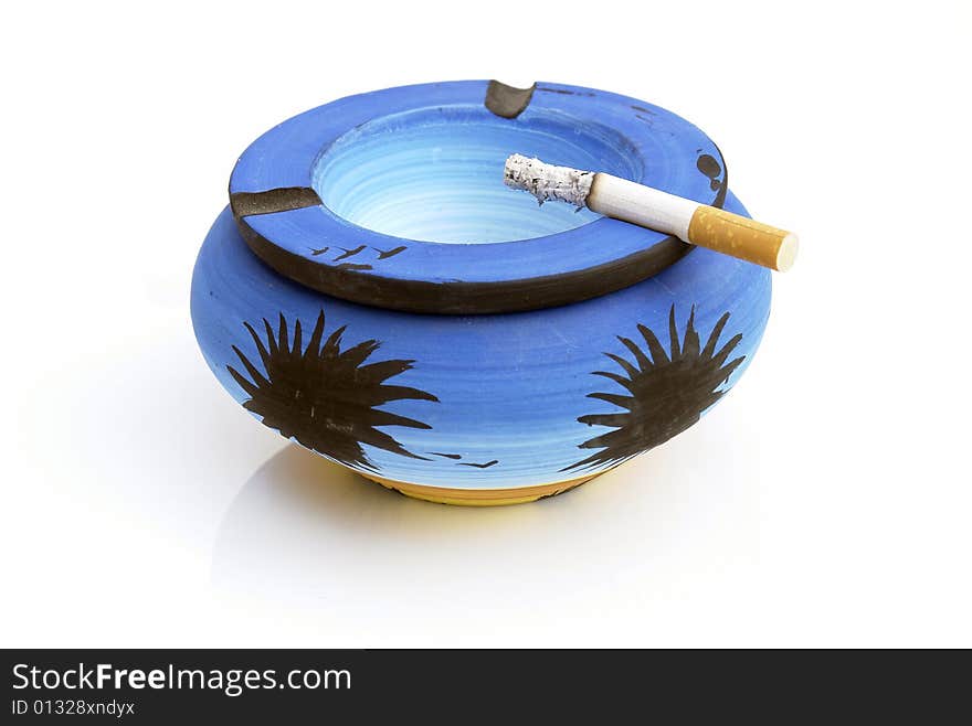 Blue ashtray on the white background