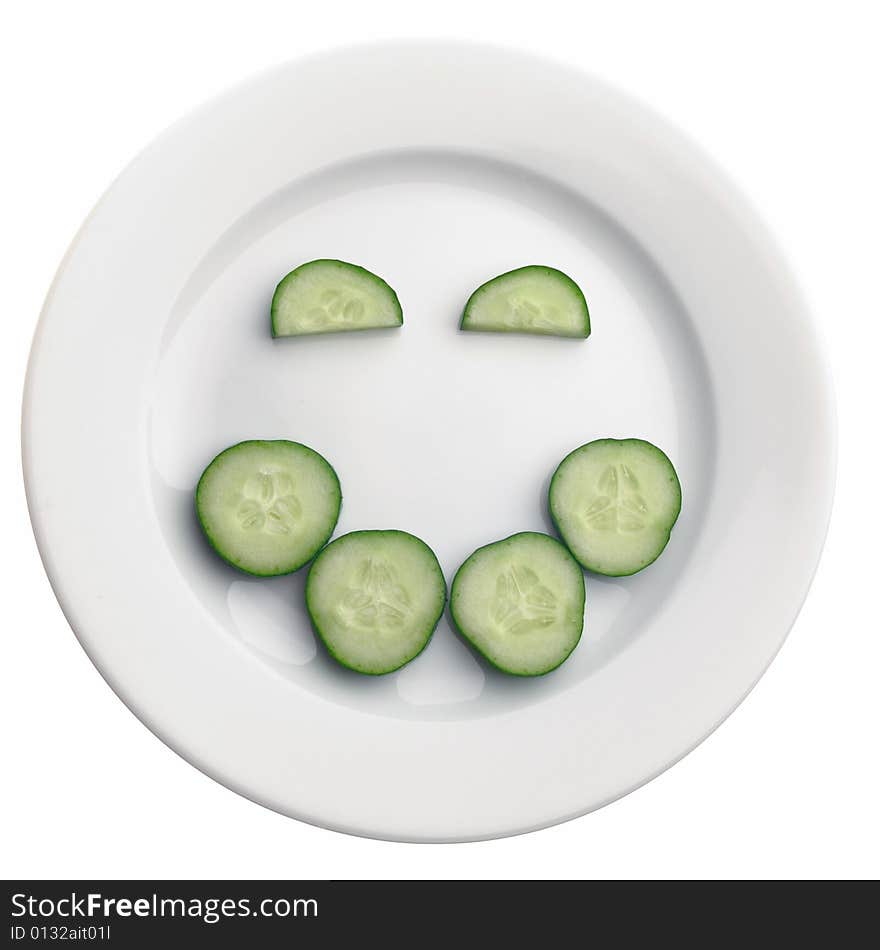 Positive face expression from cucumber's slices on the plate, isolated on white. Positive face expression from cucumber's slices on the plate, isolated on white.