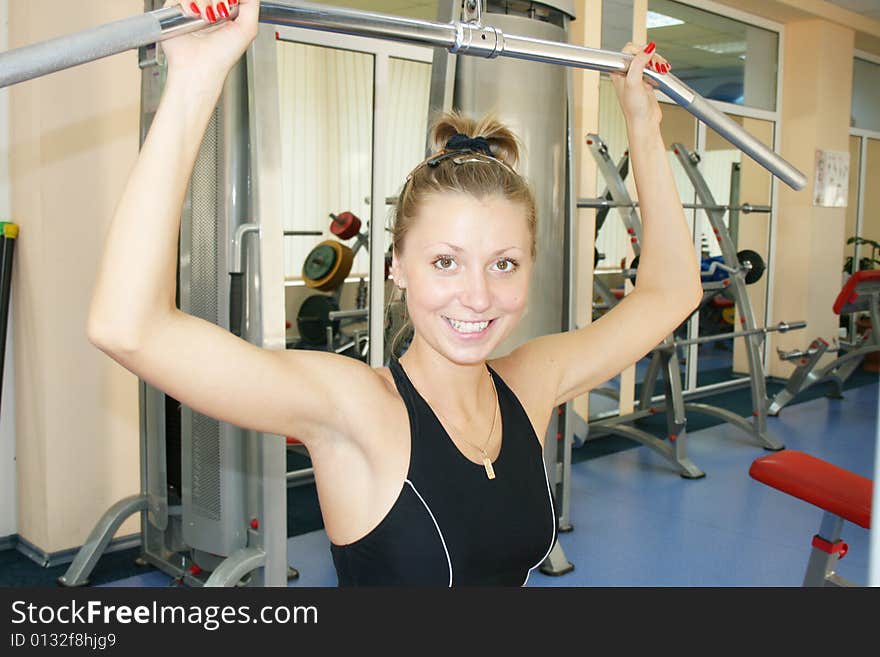 Young, beautiful woman in sport hall. Young, beautiful woman in sport hall