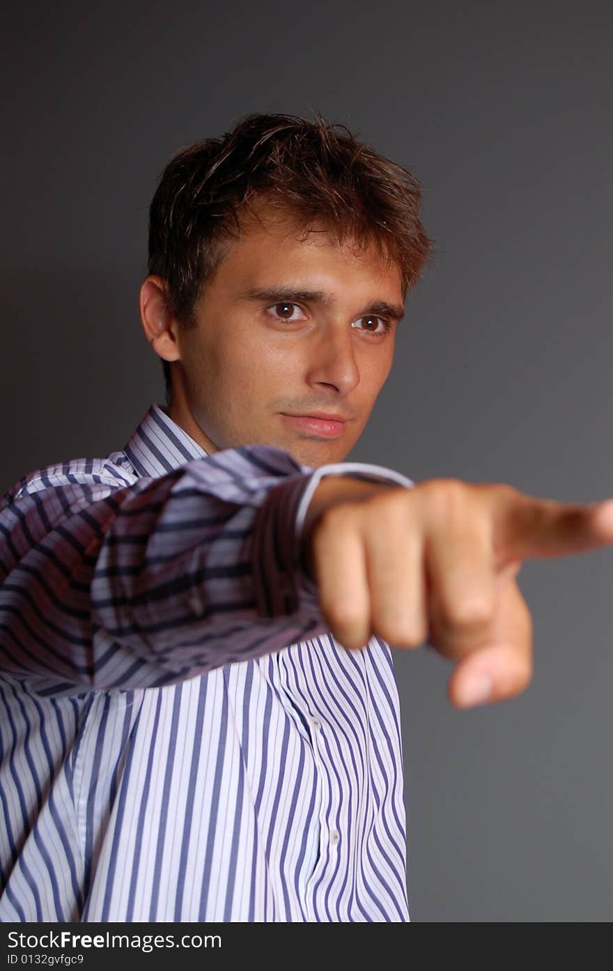 Studio photo of a guy firing someone. Studio photo of a guy firing someone