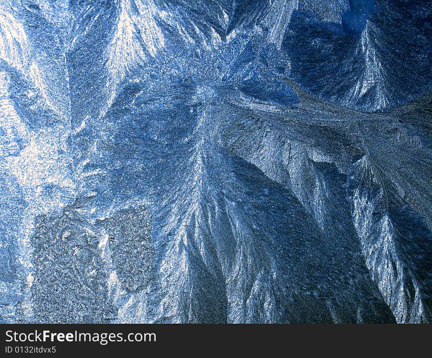 Icy pattern on window, frosty winter