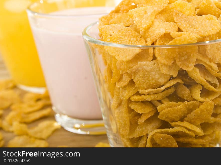 Corn flakes,yoghurt and orange juice. Corn flakes,yoghurt and orange juice