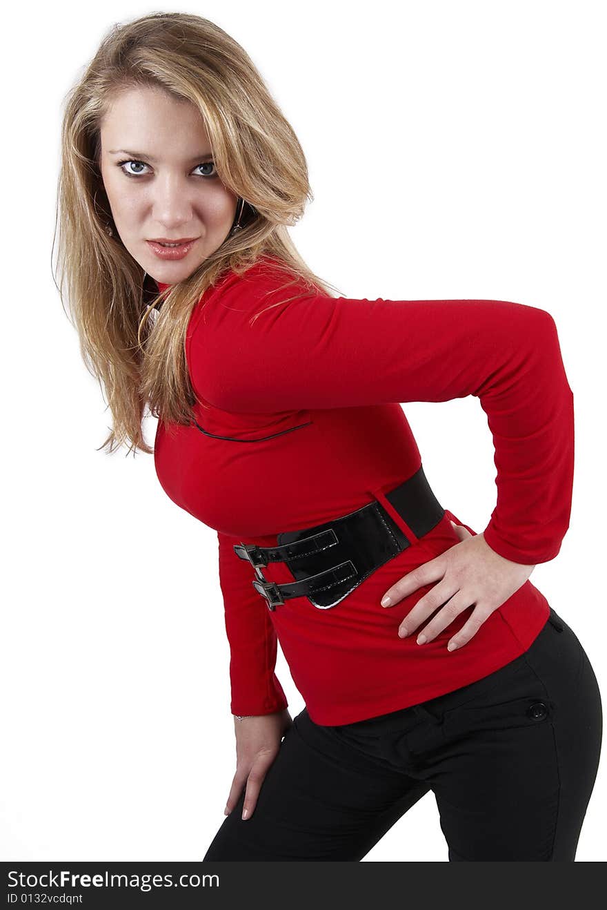 Beautiful blonde woman wearing a red top and black pants. Isolated on white background