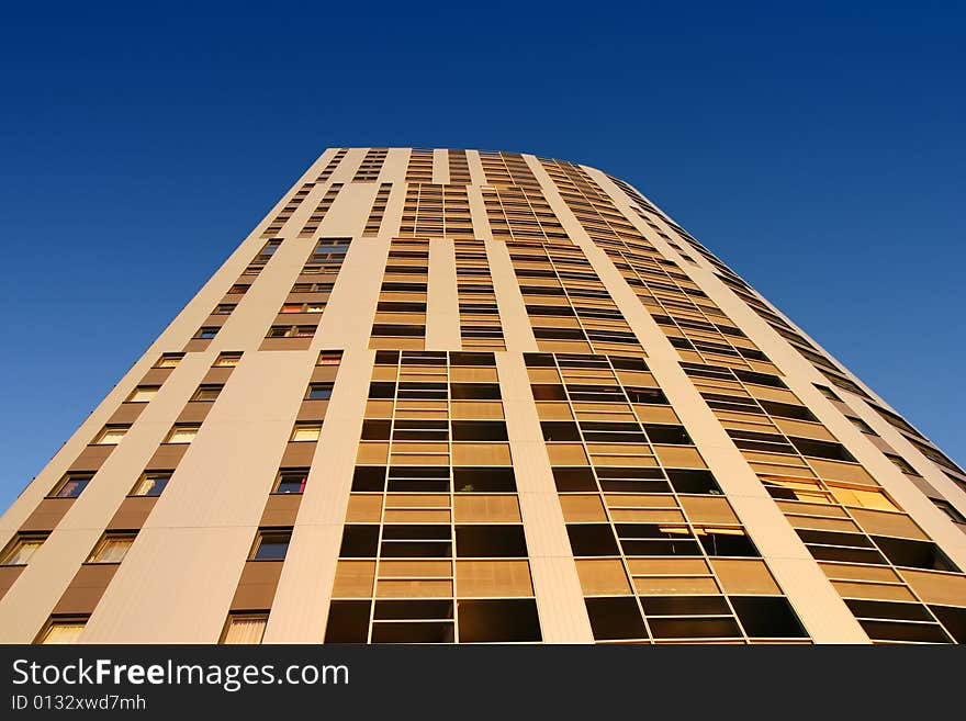 Office building against blue sky