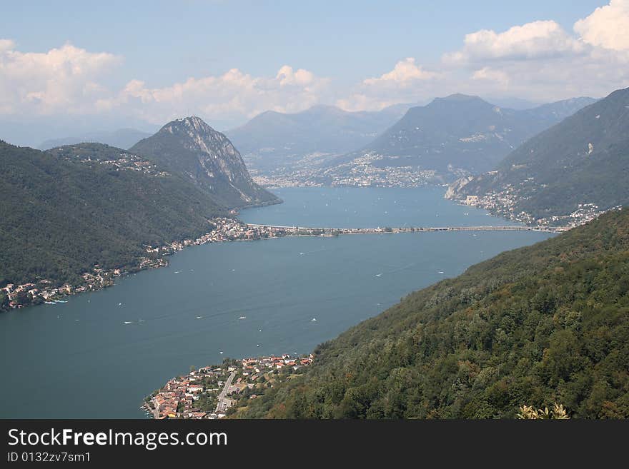 View of Lugano Lake with bridge of melide